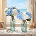 Two light blue Chuangdi coastal glass vases with boho rope, one larger and one smaller, ready for floral arrangements.
