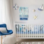 MODE HOME wooden wall plaque with a blue distressed finish, featuring a white starfish and the text "The Beach is My Happy Pl