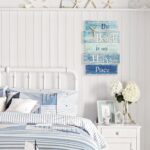 MODE HOME wooden wall plaque with a blue distressed finish, featuring a white starfish and the text "The Beach is My Happy Pl