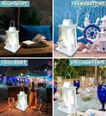 A white and blue wooden lantern candle holder with nautical ropes and a starfish, sitting on a surface.