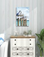 SUMGAR vertical coastal wall art with six curious seagulls on dock pilings, blue ocean background, 16x24 inches.