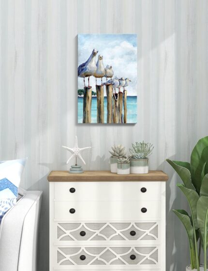 SUMGAR vertical coastal wall art with six curious seagulls on dock pilings, blue ocean background, 16x24 inches.