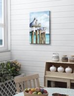 SUMGAR vertical coastal wall art with six curious seagulls on dock pilings, blue ocean background, 16x24 inches.