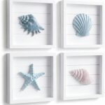 A set of four 7x7 inch framed 3D coastal wall art pieces featuring hand-painted seashells, conch shells, and starfish in past