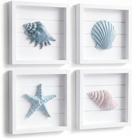 A set of four 7x7 inch framed 3D coastal wall art pieces featuring hand-painted seashells, conch shells, and starfish in past