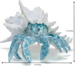 A vibrant blue hermit crab statue with its shell, designed for coastal or beach-themed home decor.