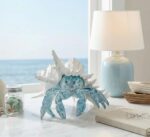 A vibrant blue hermit crab statue with its shell, designed for coastal or beach-themed home decor.